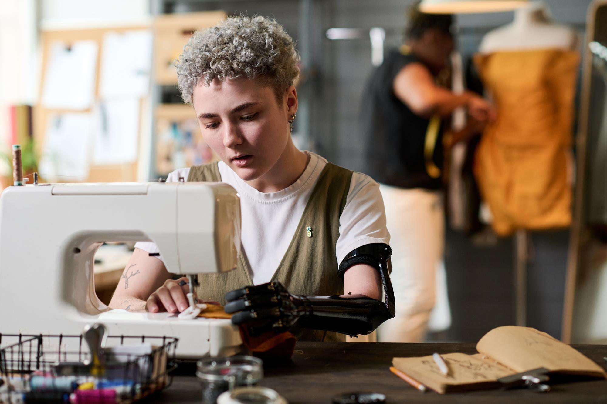 Portrait of lead embroiderer working at machine