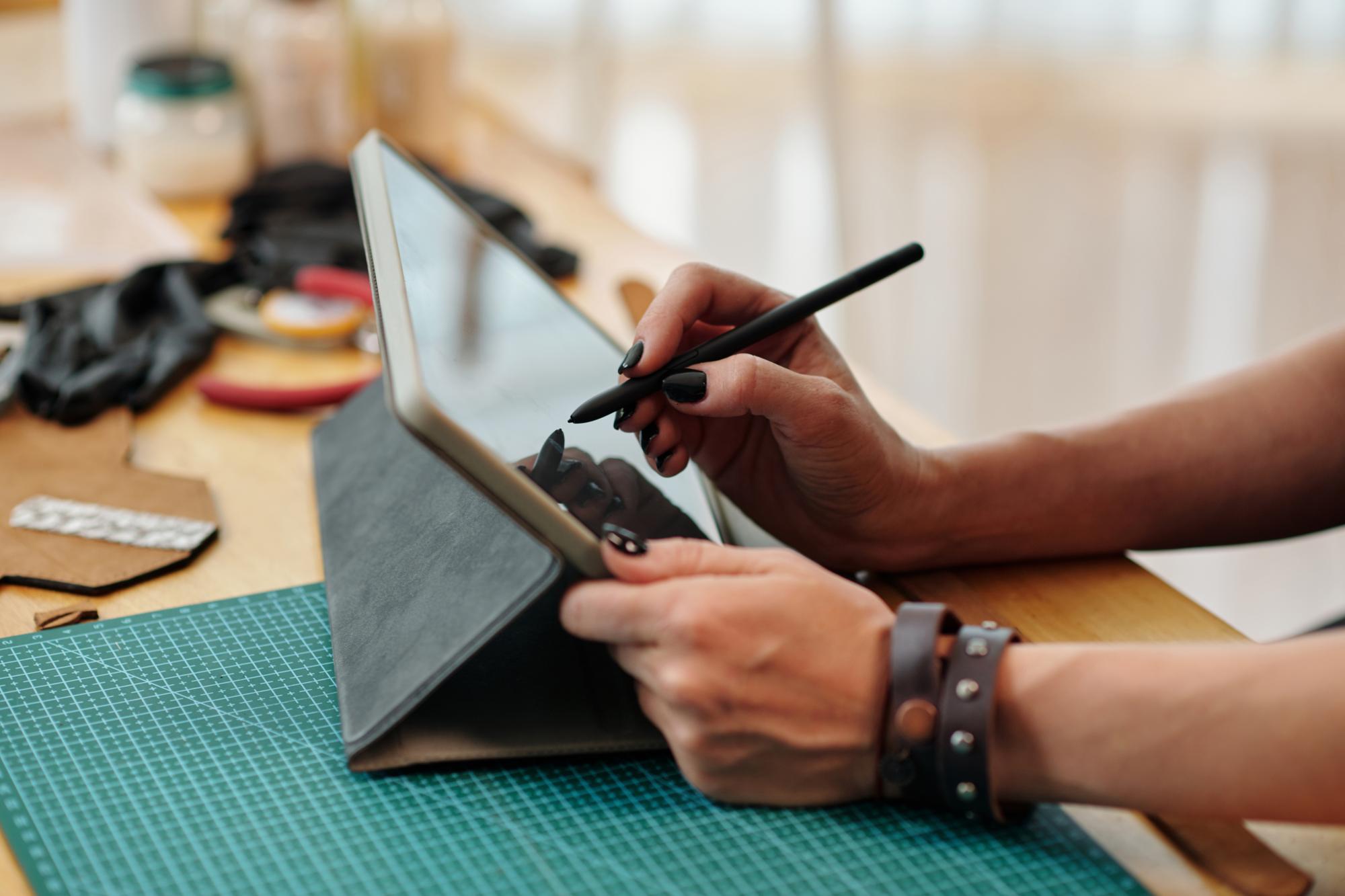 Technician adjusting digitizing tablet